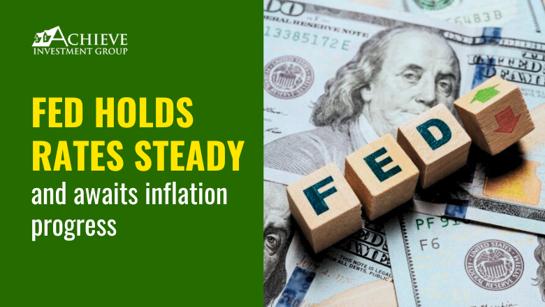 Fed holds rates steady and awaits inflation progress